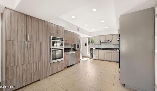 7012 N 22nd St, Phoenix, AZ 85020 - kitchen featuring sink, light tile patterned floors, stainless steel appliances, and tasteful backsplash