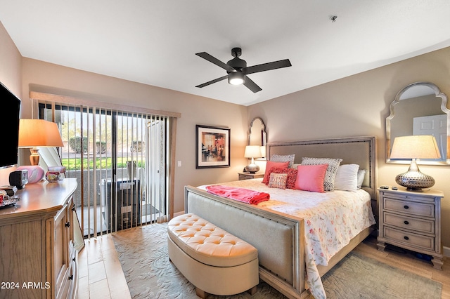 bedroom featuring access to exterior, light hardwood / wood-style flooring, and ceiling fan