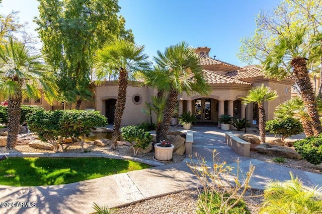 mediterranean / spanish-style house featuring french doors