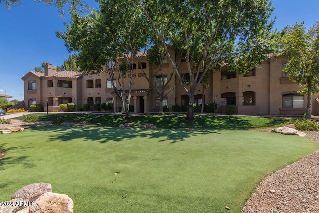 view of community with a lawn