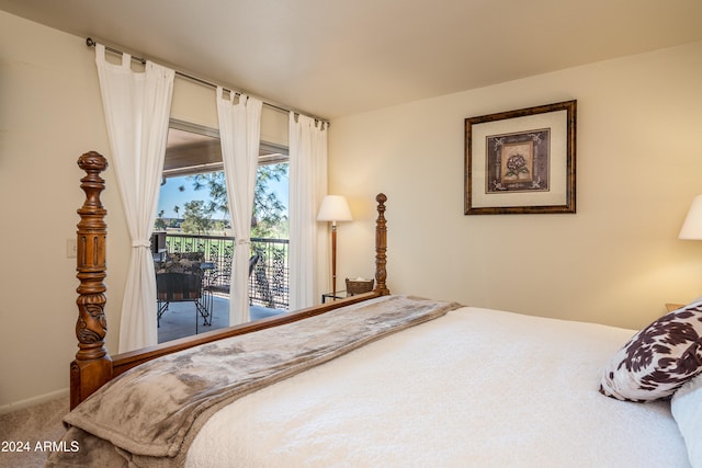 carpeted bedroom featuring access to exterior