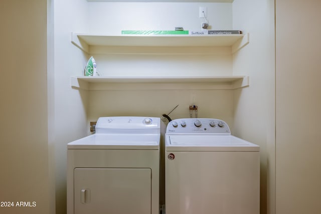 clothes washing area featuring washing machine and dryer