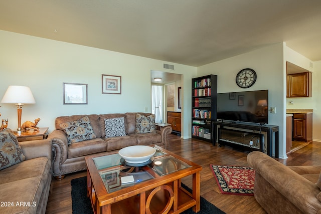 living room featuring dark wood-type flooring