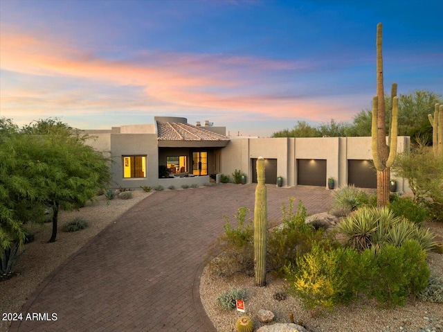 southwest-style home with a garage