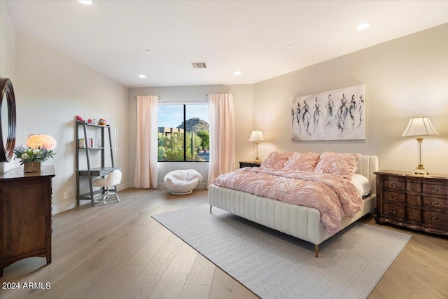 bedroom with light hardwood / wood-style floors