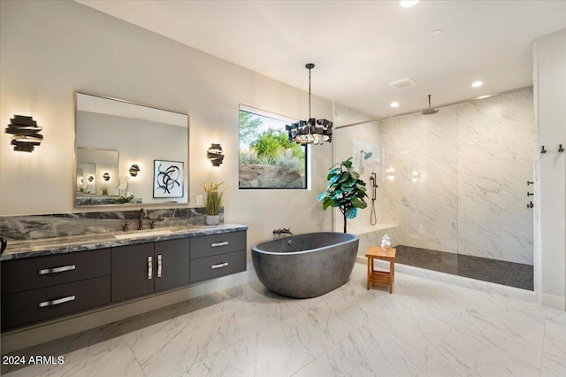 bathroom with vanity, plus walk in shower, a notable chandelier, and tile walls