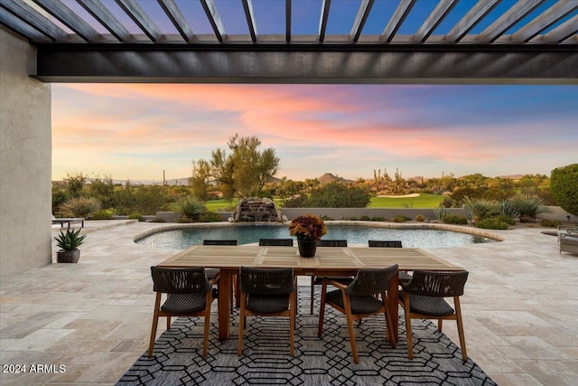 view of patio terrace at dusk