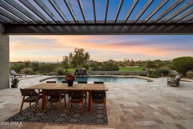 view of patio terrace at dusk