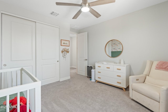 21134 W Minnezona Ave, Buckeye, AZ 85396 - bedroom with carpet floors, a closet, a ceiling fan, baseboards, and a crib