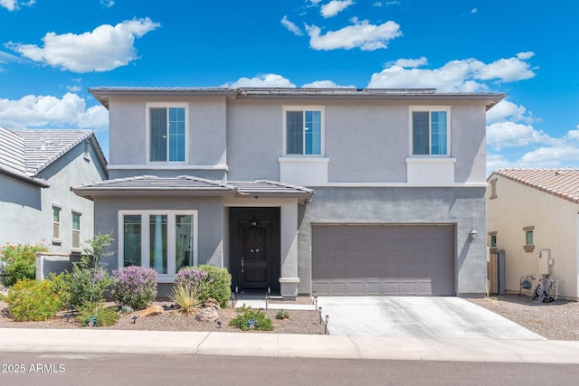 21134 W Minnezona Ave, Buckeye, AZ 85396 - traditional-style house featuring a garage, driveway, stucco siding, and a tiled roof