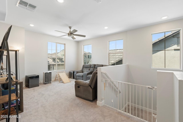 21134 W Minnezona Ave, Buckeye, AZ 85396 - living room with carpet floors, plenty of natural light, recessed lighting, ceiling fan, and baseboards