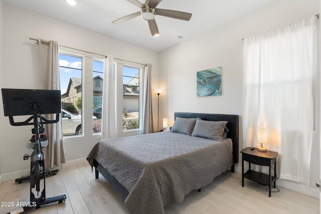 21134 W Minnezona Ave, Buckeye, AZ 85396 - bedroom with light wood finished floors, baseboards, a ceiling fan, and recessed lighting