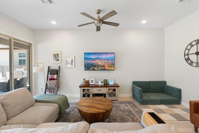 21134 W Minnezona Ave, Buckeye, AZ 85396 - living area with ceiling fan, baseboards, and recessed lighting