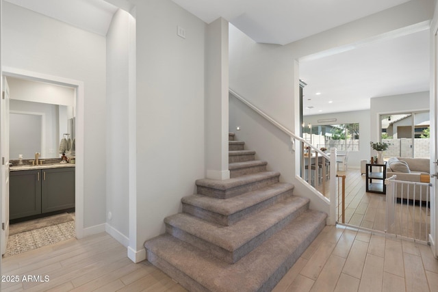 21134 W Minnezona Ave, Buckeye, AZ 85396 - stairway featuring wood finished floors, baseboards, and recessed lighting