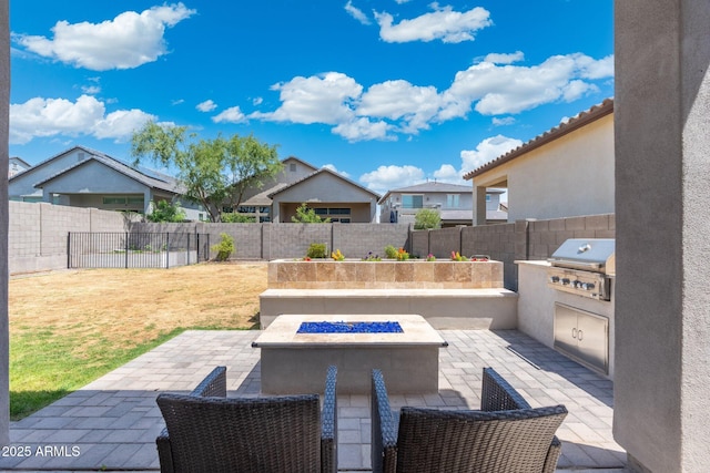 21134 W Minnezona Ave, Buckeye, AZ 85396 - fenced backyard featuring a patio, a fire pit, and a residential view