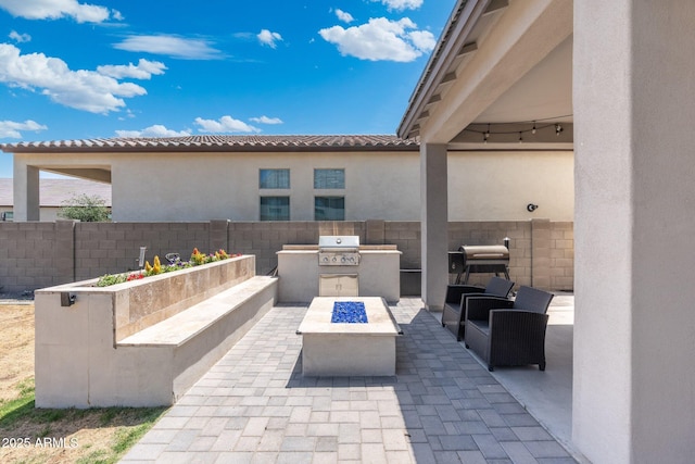 21134 W Minnezona Ave, Buckeye, AZ 85396 - view of patio featuring an outdoor living space with a fire pit