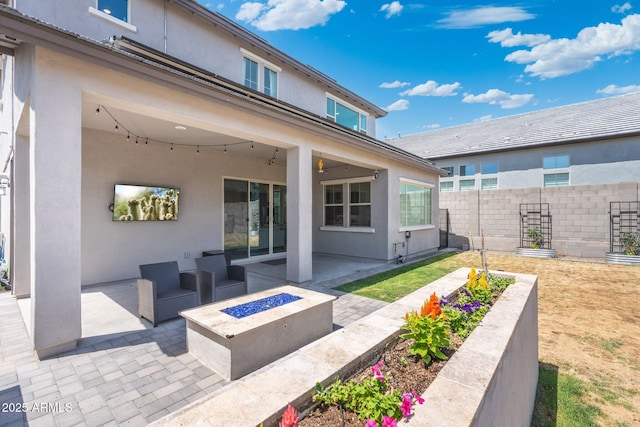 21134 W Minnezona Ave, Buckeye, AZ 85396 - view of patio / terrace featuring an outdoor fire pit