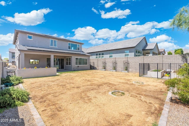 21134 W Minnezona Ave, Buckeye, AZ 85396 - back of property with a fenced backyard and stucco siding
