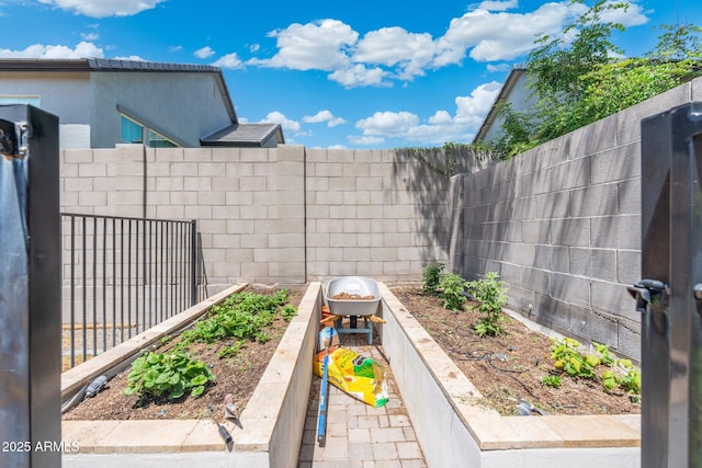 21134 W Minnezona Ave, Buckeye, AZ 85396 - view of patio / terrace featuring a vegetable garden