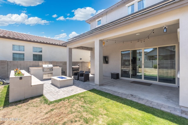 21134 W Minnezona Ave, Buckeye, AZ 85396 - view of patio / terrace featuring an outdoor living space with a fire pit