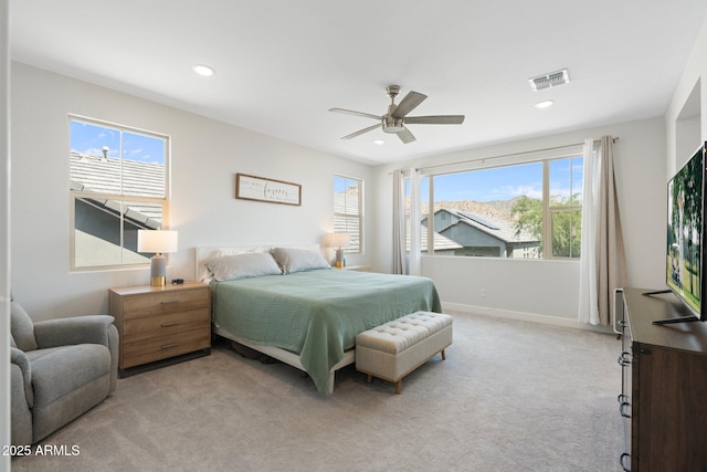 21134 W Minnezona Ave, Buckeye, AZ 85396 - bedroom with multiple windows, light carpet, a ceiling fan, and recessed lighting