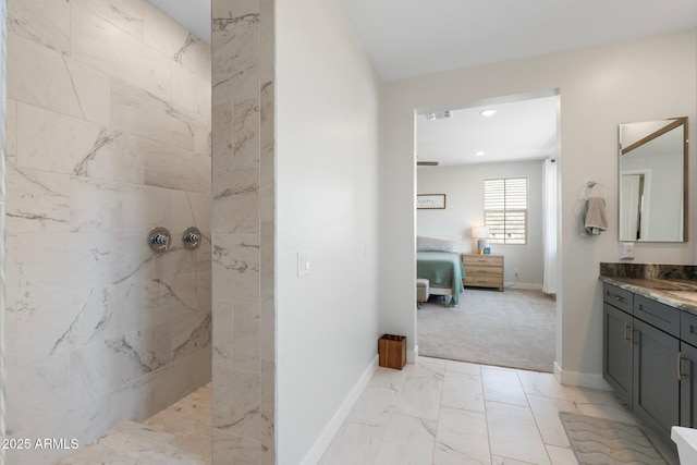 21134 W Minnezona Ave, Buckeye, AZ 85396 - full bathroom with walk in shower, marble finish floors, vanity, and baseboards