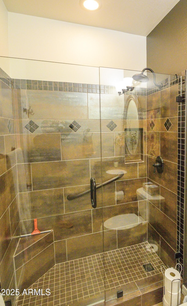 full bath featuring a shower stall