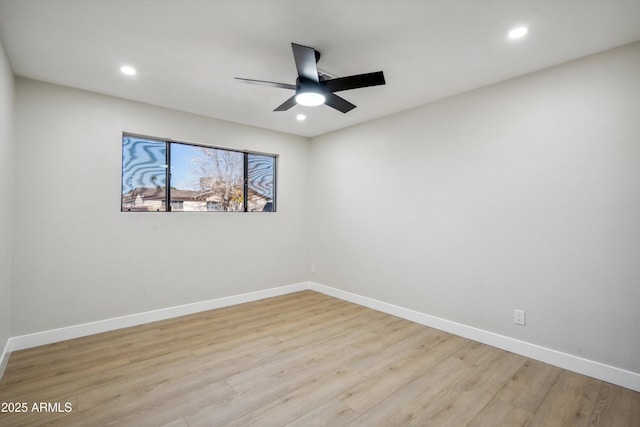 spare room with light hardwood / wood-style floors and ceiling fan