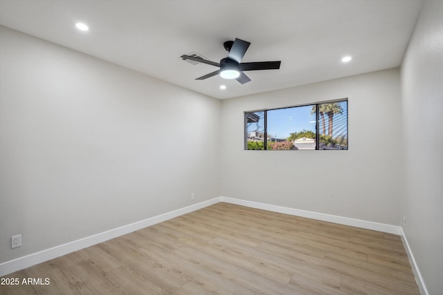 unfurnished room with ceiling fan and light wood-type flooring