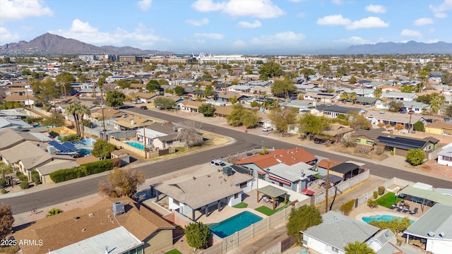 birds eye view of property featuring a mountain view