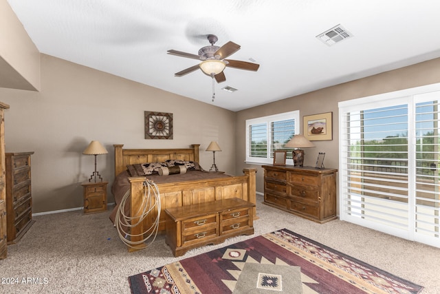 bedroom with ceiling fan, light colored carpet, and lofted ceiling