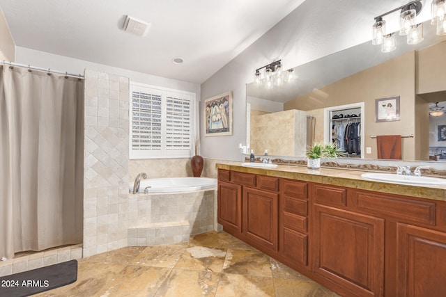 bathroom with vanity, lofted ceiling, and plus walk in shower