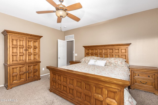 bedroom featuring ceiling fan and light carpet