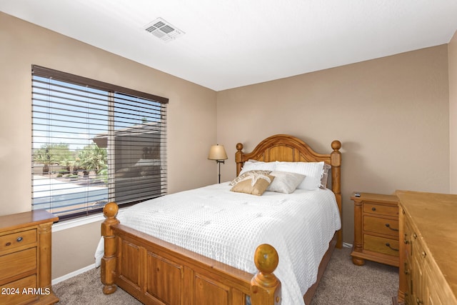 bedroom featuring light carpet