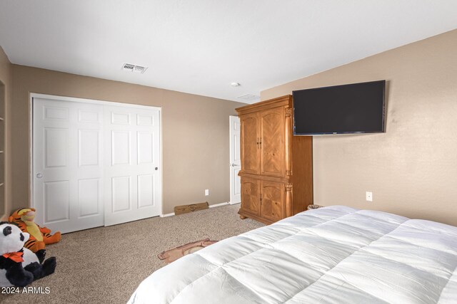 carpeted bedroom featuring a closet