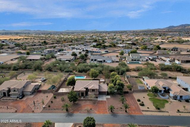 birds eye view of property featuring a mountain view