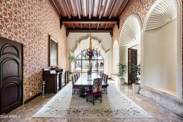 dining space with beamed ceiling, wood ceiling, and a chandelier