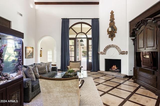 living room with a towering ceiling