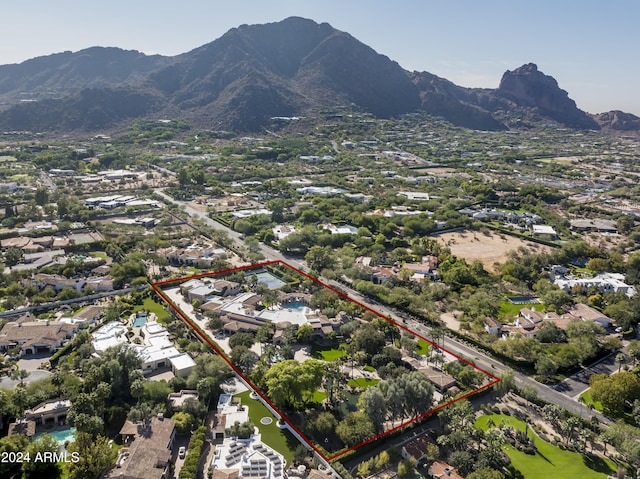 birds eye view of property with a mountain view