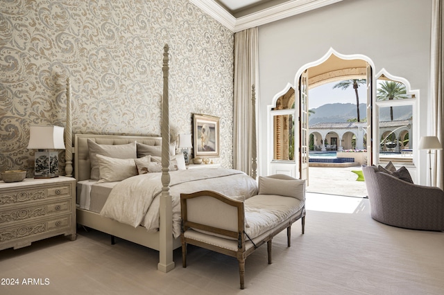 bedroom featuring a mountain view, access to outside, and ornamental molding