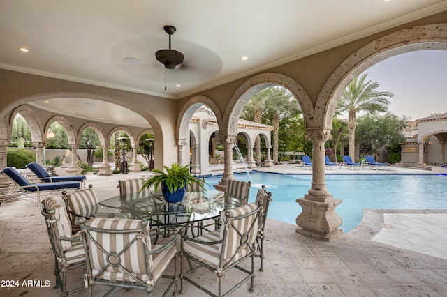 view of pool featuring ceiling fan and a patio area