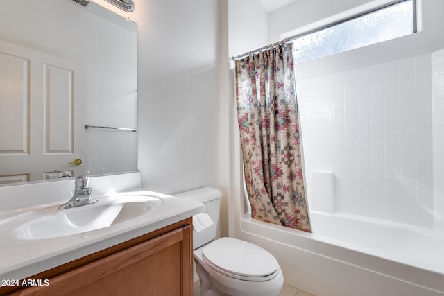 full bathroom with tile patterned flooring, vanity, shower / bath combo, and toilet