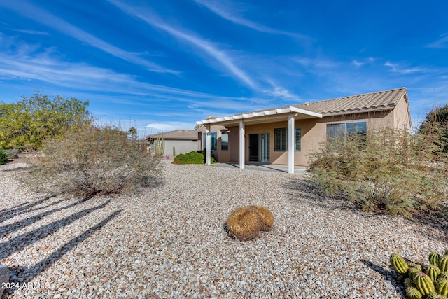 back of property with a patio area