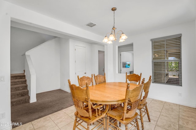 dining area with stairs, baseboards, a chandelier, light tile patterned flooring, and visible vents