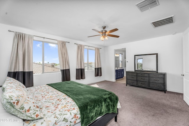 carpeted bedroom featuring baseboards, visible vents, and ceiling fan