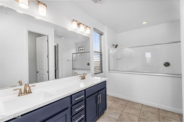 full bath with double vanity, visible vents, a sink, and walk in shower