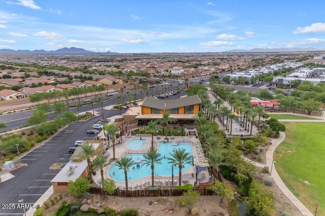 drone / aerial view featuring a residential view and a mountain view