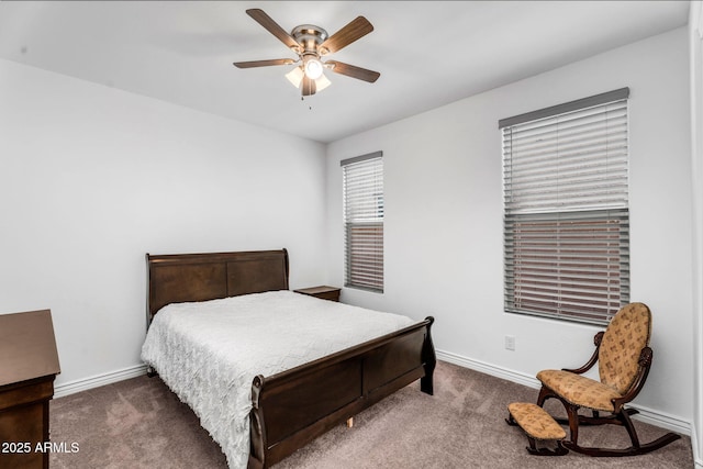 carpeted bedroom featuring a ceiling fan and baseboards