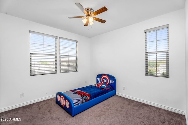 bedroom featuring carpet, baseboards, and ceiling fan