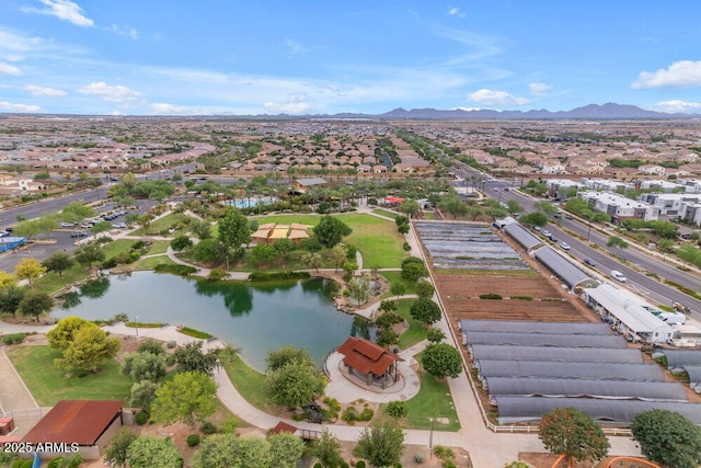 aerial view featuring a water and mountain view